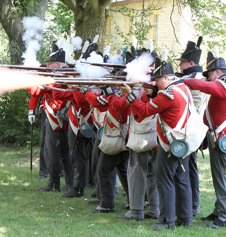 people holding muskets