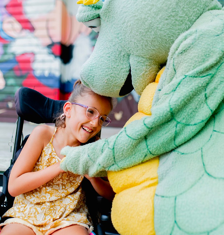 person smiling at mascot costume