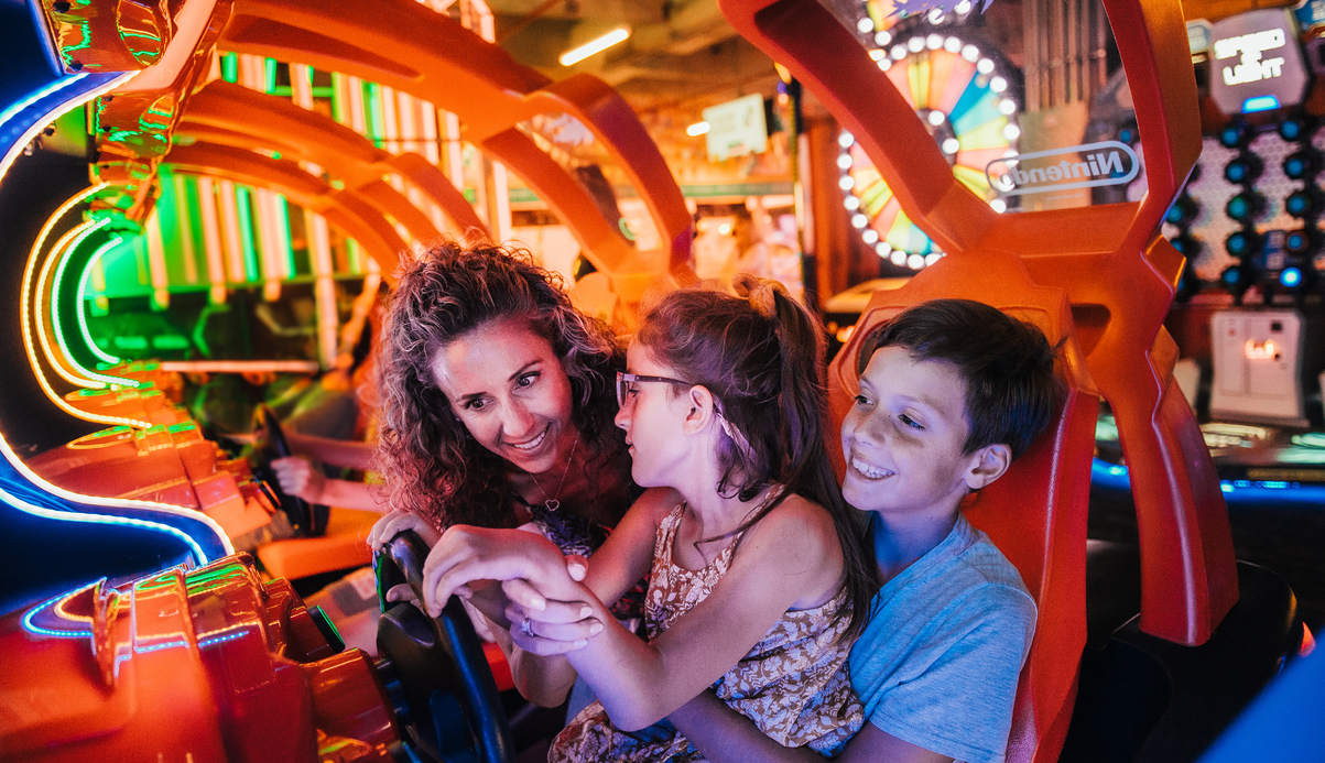 people smiling and playing at a games facility