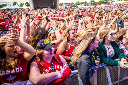 audience listening to outdoor concert