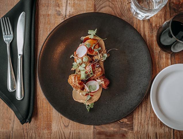 A table set with food and wine at Abruzzi Ristorante.