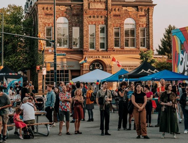 A crowd of people at an outdoor festival in Old East Village in London, Ontario.