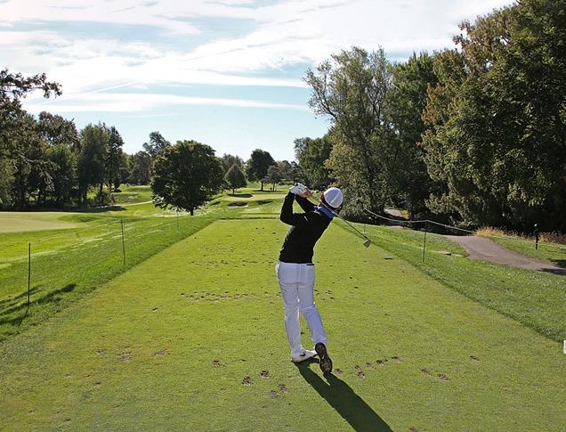 A person hitting a golf ball at the Thames Valley Golf Course locate din London, Ontario, Canada