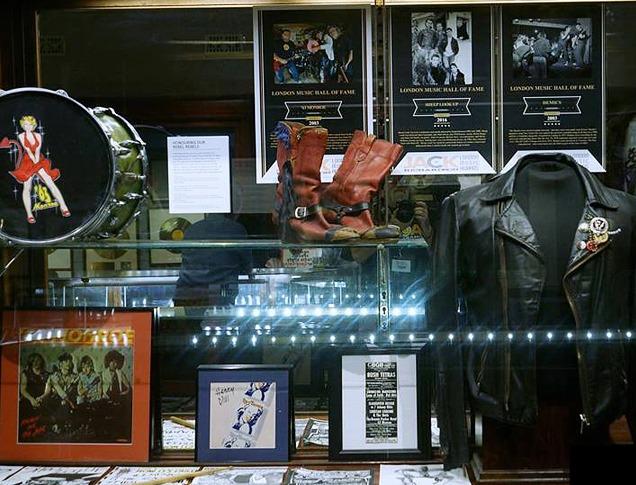 photos, jacket and drum in a showcase for the london music hall of fame