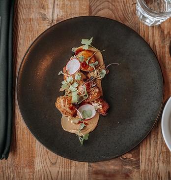 A table set with food and wine at Abruzzi Ristorante.