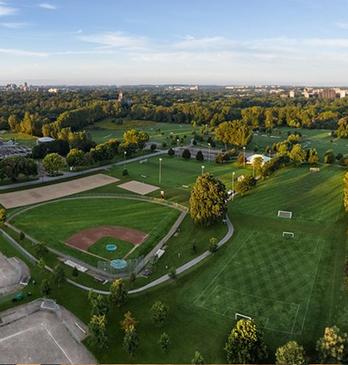 Aerial view of an outdoor park with baseball diamond and Blackfriars Bridge in London, Ontario, Canada.