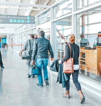 People arriving from a flight at the London International Airport located in London, Ontario, Canada