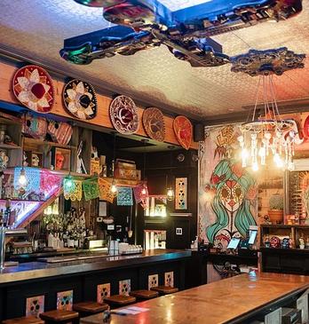 Interior view of Los Lobos' bar decorated with day of the dead artwork, located in London, Ontario