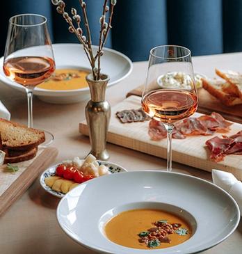 Various plated dishes and glasses of from Grace Restaurant located in London, Ontario