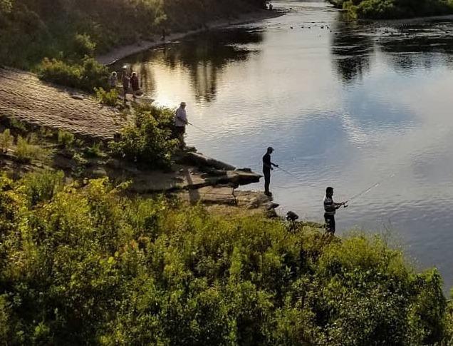 Two girls fishing in river