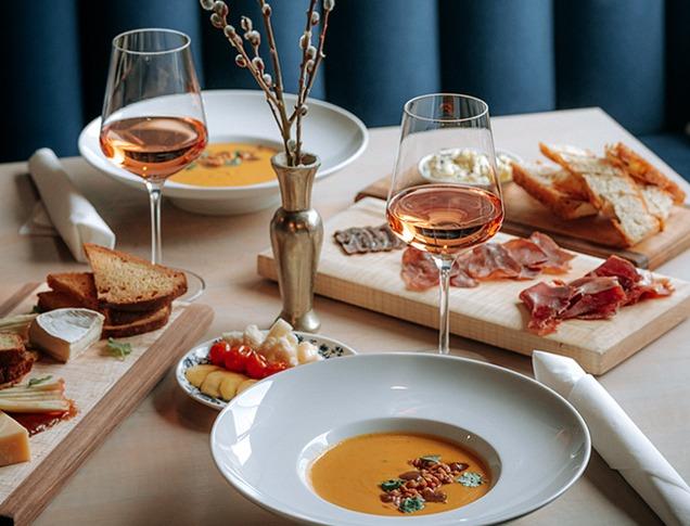 Various plated dishes and glasses of from Grace Restaurant located in London, Ontario