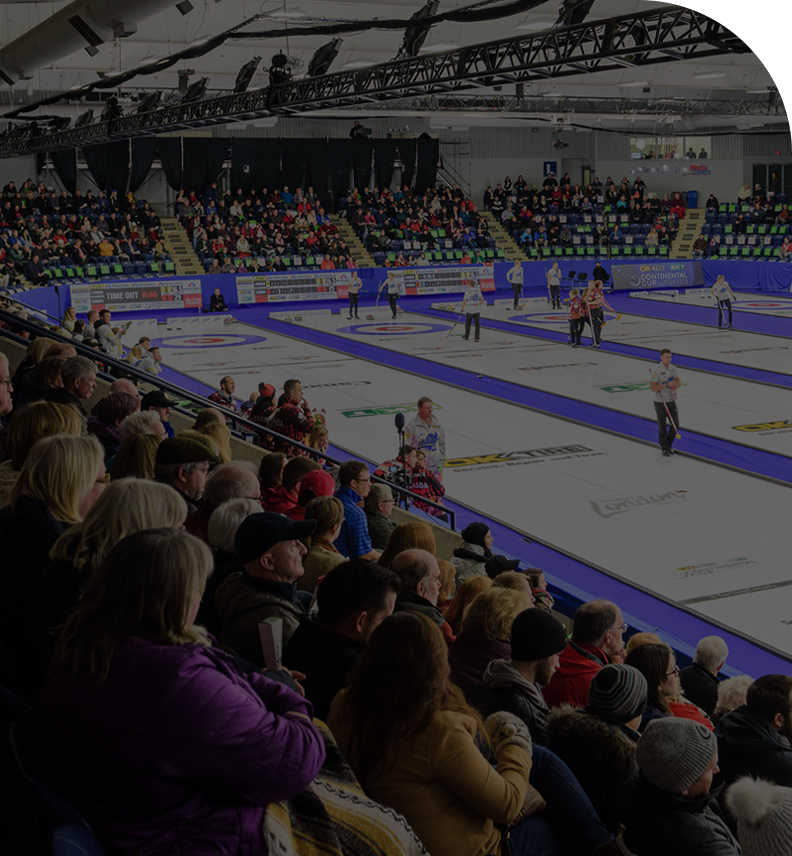 people watching a curling match