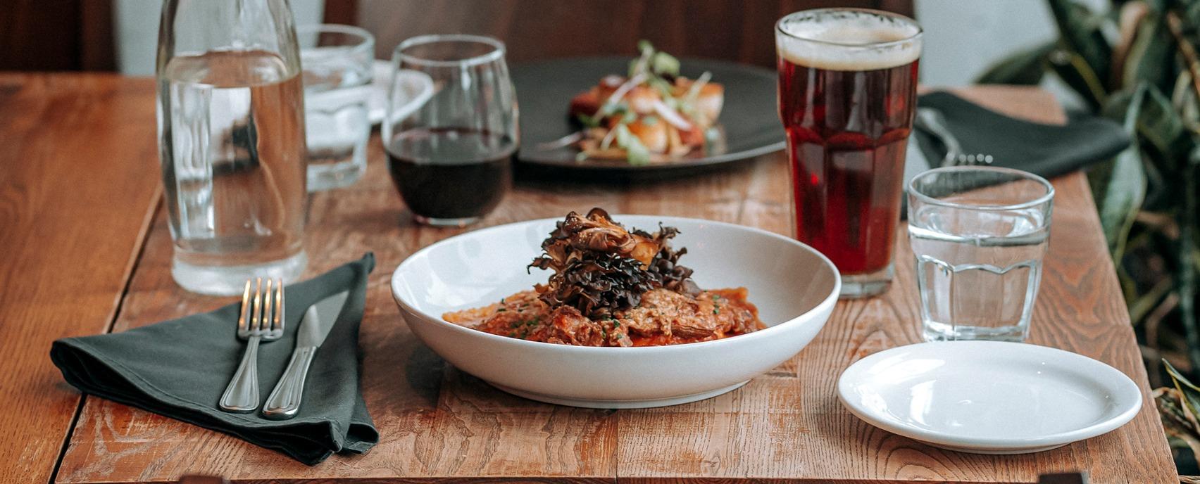 A set table with food and drinks at Abruzzi Restaurant located in London, Ontario