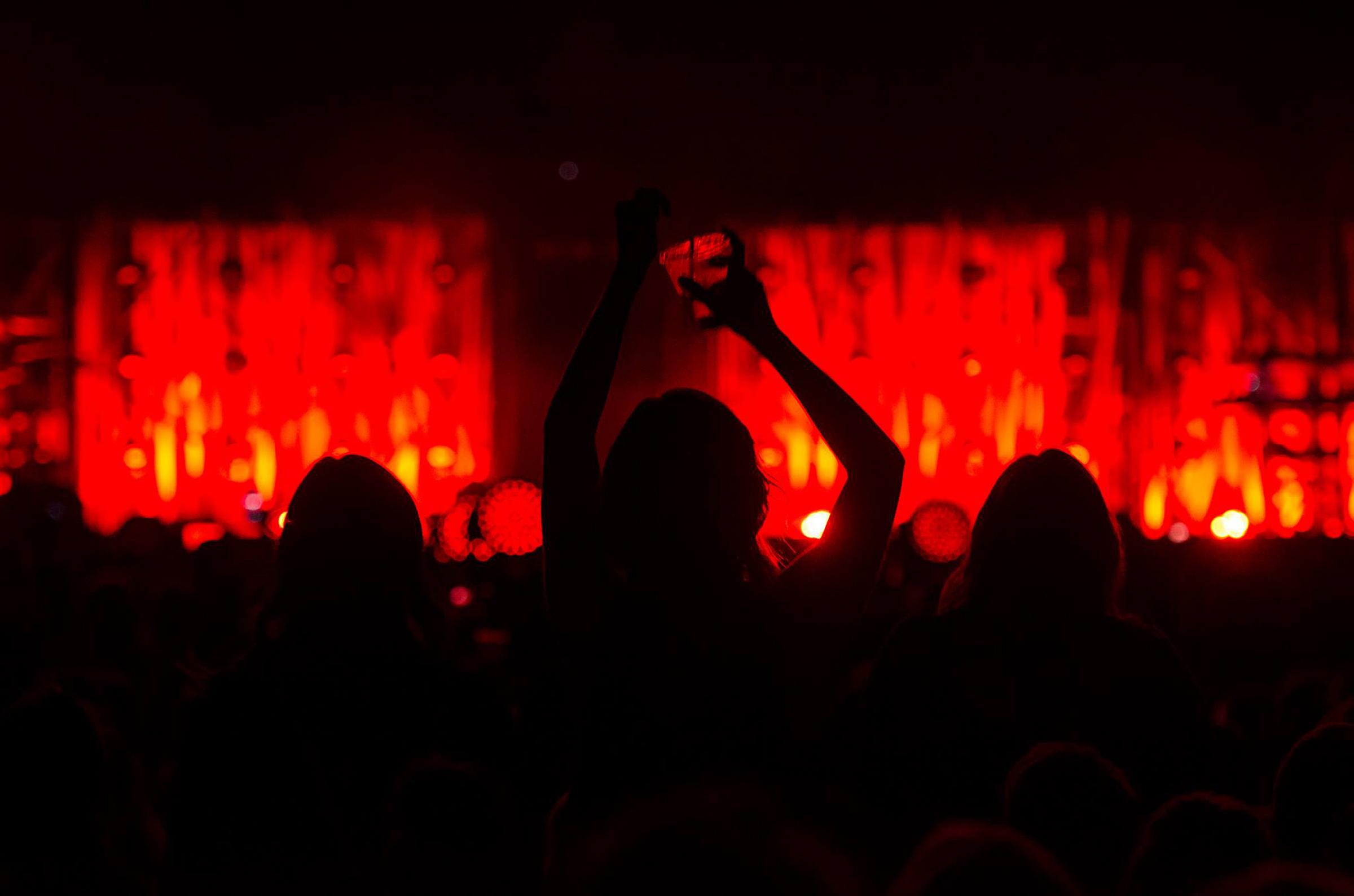 audience looking at stage in darkness