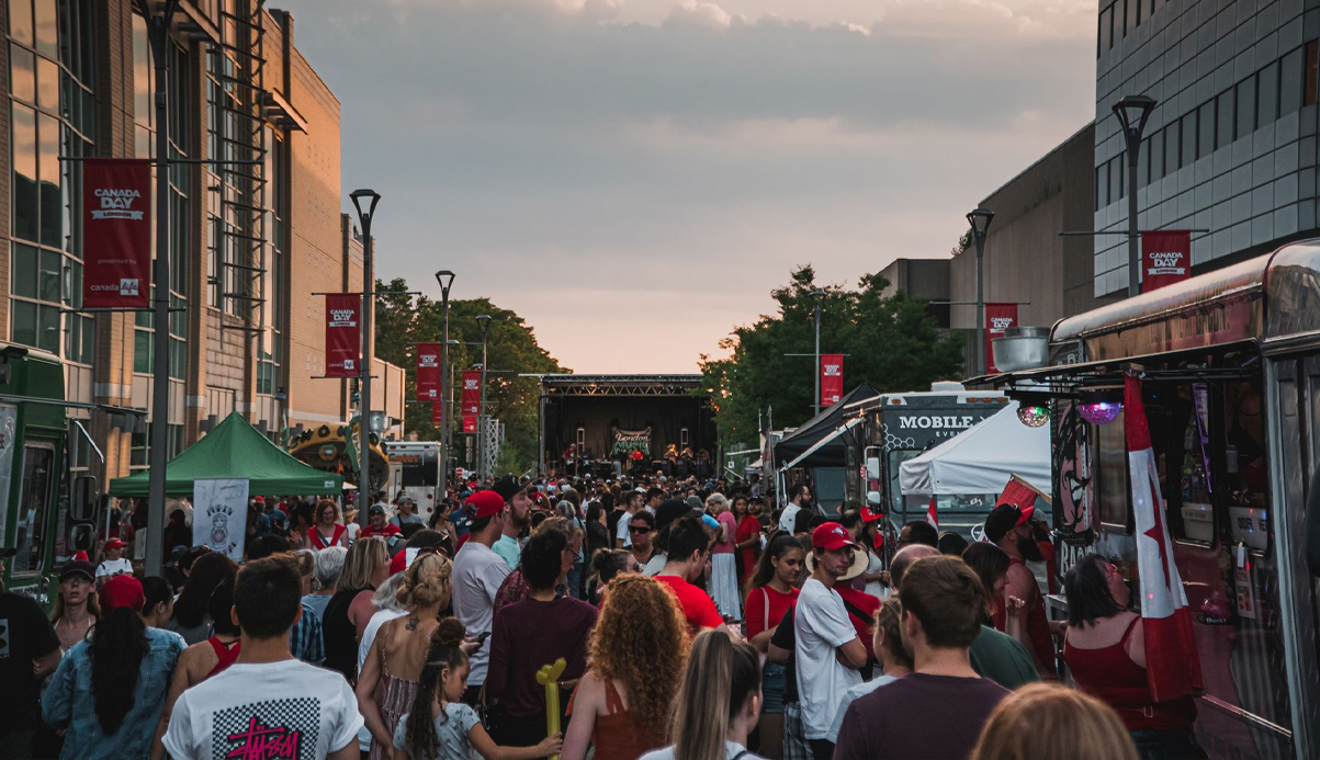 people lined in the streets enjoying a concert