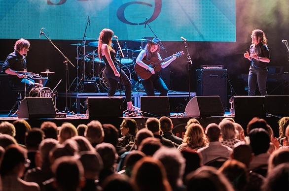 A band playing on stage to a large crowd gathered to see the Forest City London Music Awards in London, Ontario