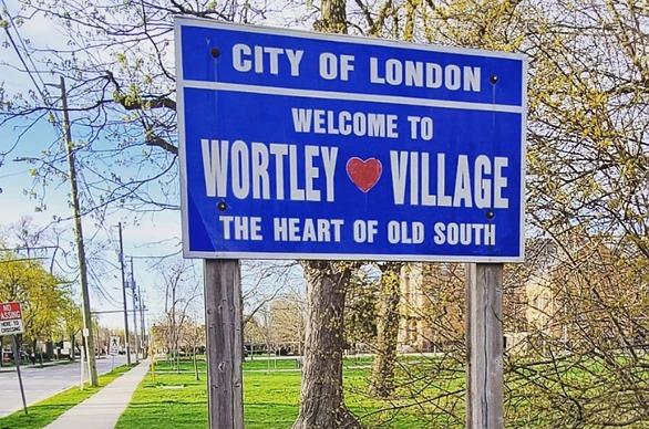 A sign outdoors that reads City of London welcome to Wortley Village located in London, Ontario