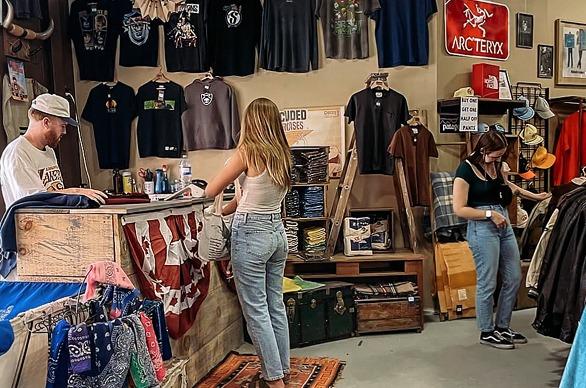 Two females shopping for vintage clothing in DugOut Vintage, located in London, Ontario