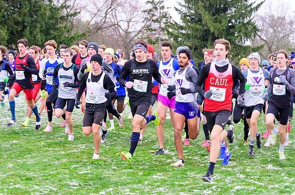 A large group of people running outdoors in The Canadian Cross Country Championships held in London, Ontario