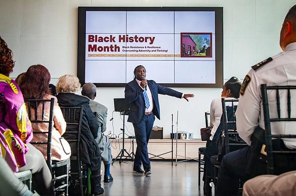 People sitting and listening to a speaker holding a presentation at Museum London located in London, Ontairo
