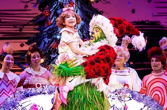 Actors on stage performing the a scene from the theatre production of Dr. Seuss' How the Grinch Stole Christmas! The Musical