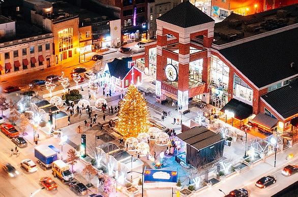 A bright lit Christmas tree in front of Covent Garden Market's main entrance located in London, Ontario