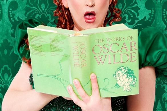 An actreess reading a book from the production of The Being Earnest playing at the Grand Theatre located in London, Ontario