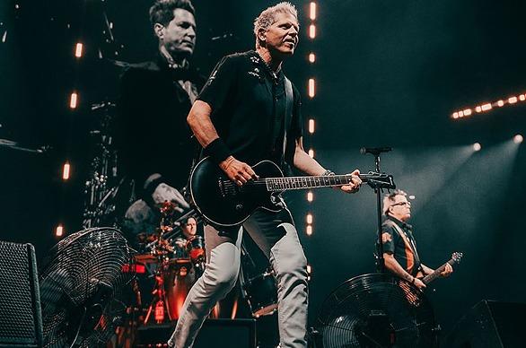 Band members of the punk Rock band The Offspring performing live on stage
