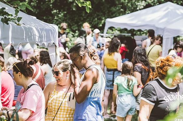 A large group of people gathered outdoors attending the Soft Fest locate din London, Ontario