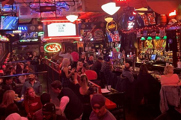 A large crowd of customers gathered inside of the bar Joe Kool's located in London, Ontario