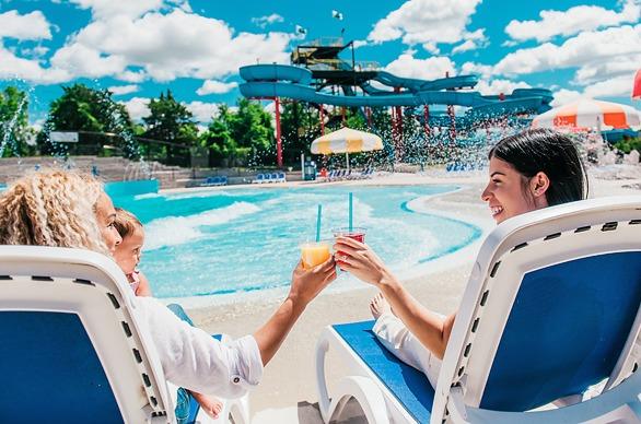 A family enjoy a nice summer day by the wave pool at East Park located in London, Ontario