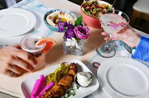 A table top view of various dishes prepared at Yasmine’s - authentic Lebanese cuisine located in London, Ontario
