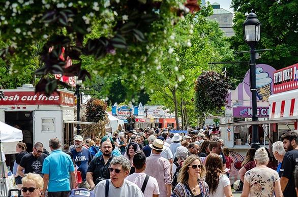 A large group of people gathered in Victoria Park for The London International Food Festival held in London, Ontario