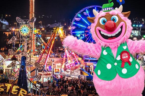 A night time aerial view of the Western Fairgrounds with various rides and games brightly lit locate din London, Ontario