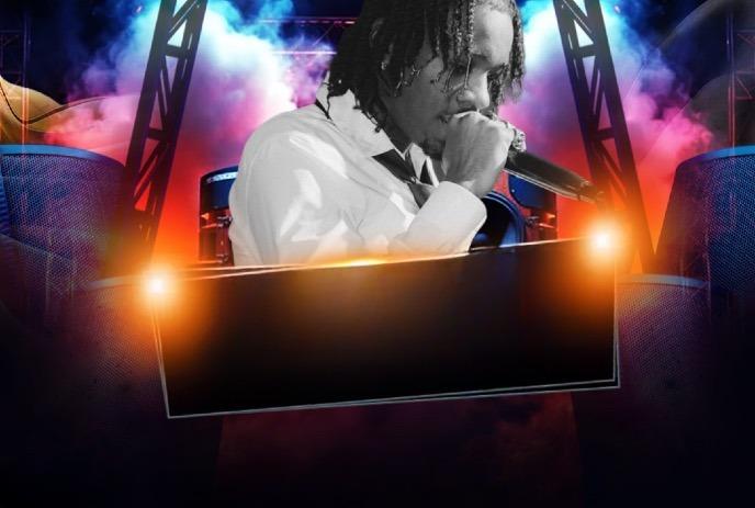 Fresco Trey performs in a white shirt on a vibrant stage with colorful lights, smoke, and speakers.