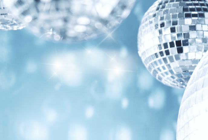 Bright disco balls shimmering against a blue and white background.