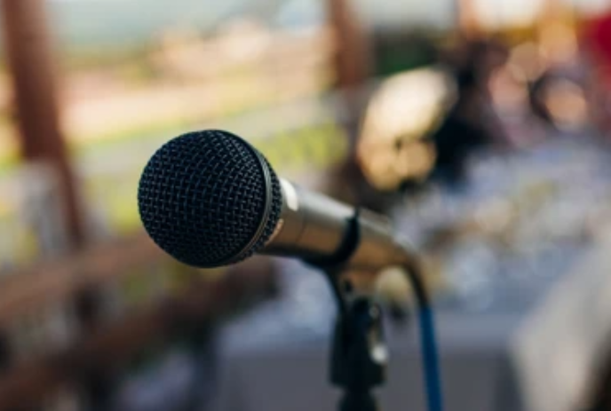 A microphone with a blurred background.