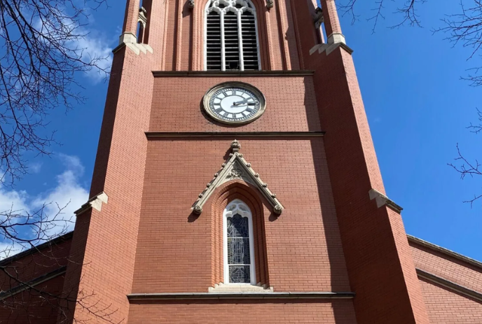 St. Paul's Anglican Cathedral bell tower and clock on a sunny day.