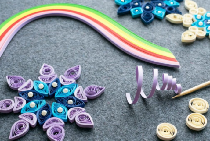 Intricate designs made from quilling, a historical art form.