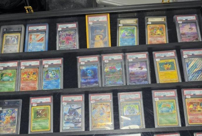 A collection of collectable cards on the display for sale.