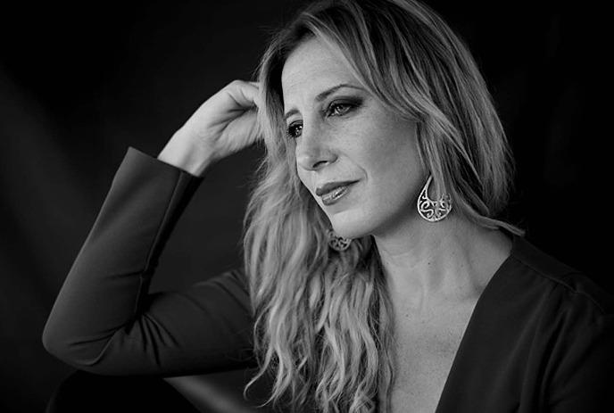 Black and white image of a person looking off into the distance.