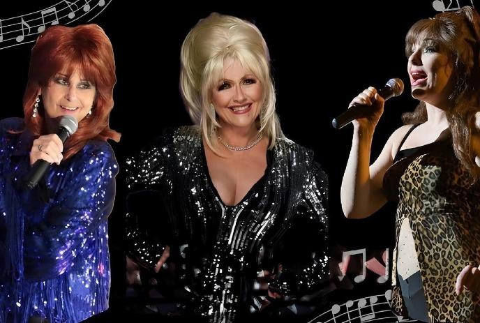 Three women on stage, each holding microphones, are dressed in glittery outfits, exuding confidence.