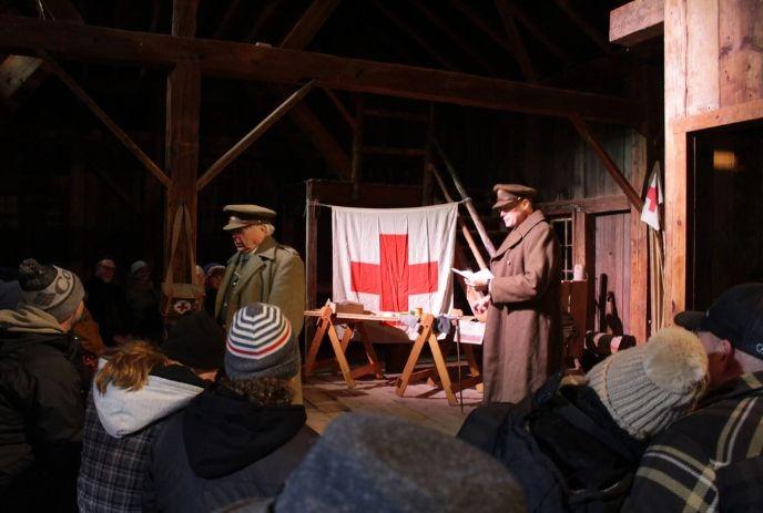 Spectators enjoying a World War I reenactment demonstration.