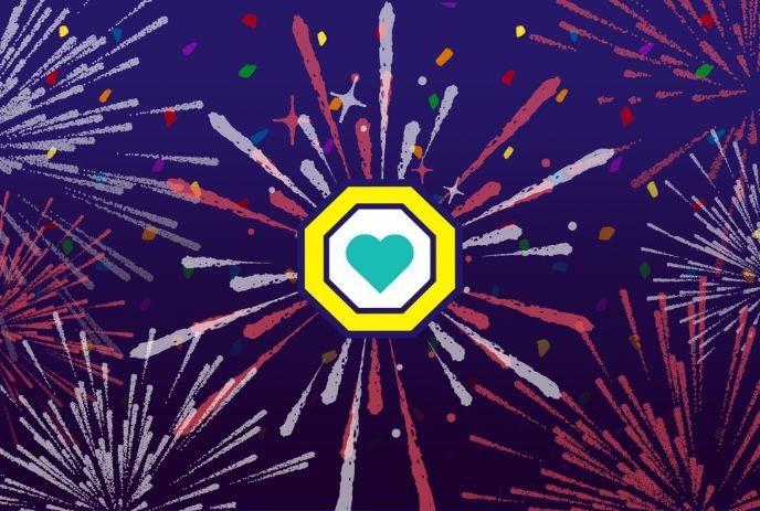 Fireworks in a vibrant display around a hexagon holding a teal heart, symbolizing love and celebration.