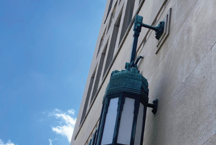 A lamp post on the side of the Dominion Building in downtown London, Ontario.