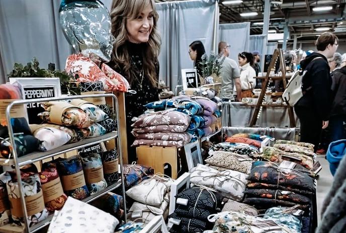 Heart shaped stained glass ornament with a maple leaf in the centre.