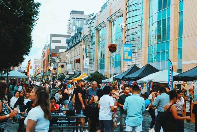 A crowd at a festival on Dundas Place Block #1.