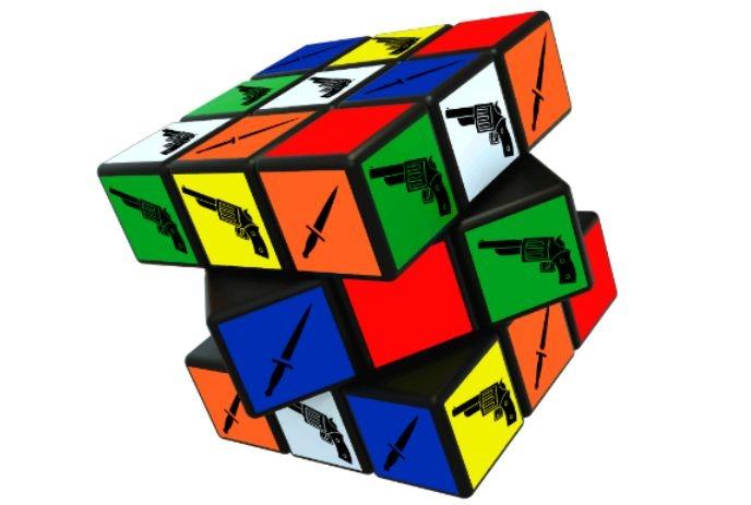 A colorful Rubik's cube with black gun and knife symbols on each square.