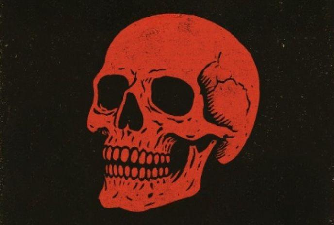A red skull under a black background