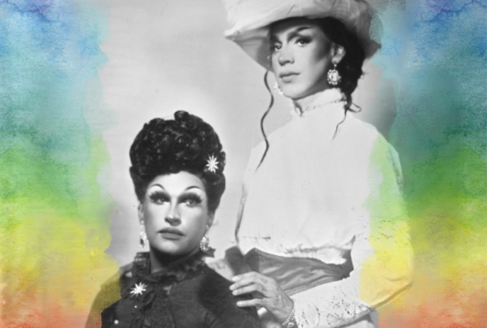 Two drag queens posing for a photo with a colourful background.